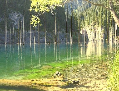 Kaindy Lake, an idyllic turquoise mountain lake in Almaty region, Kazakhstan